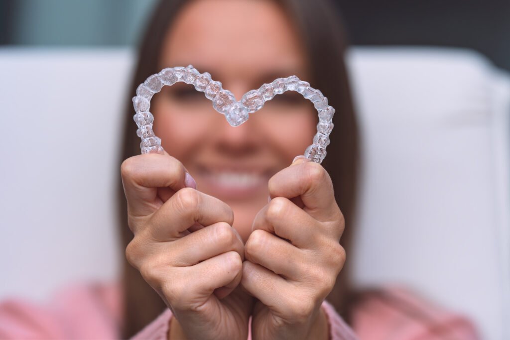 Considering Invisalign Treatment for Underbite Correction? Here's What You Should Know 9 Woman with dental invisible